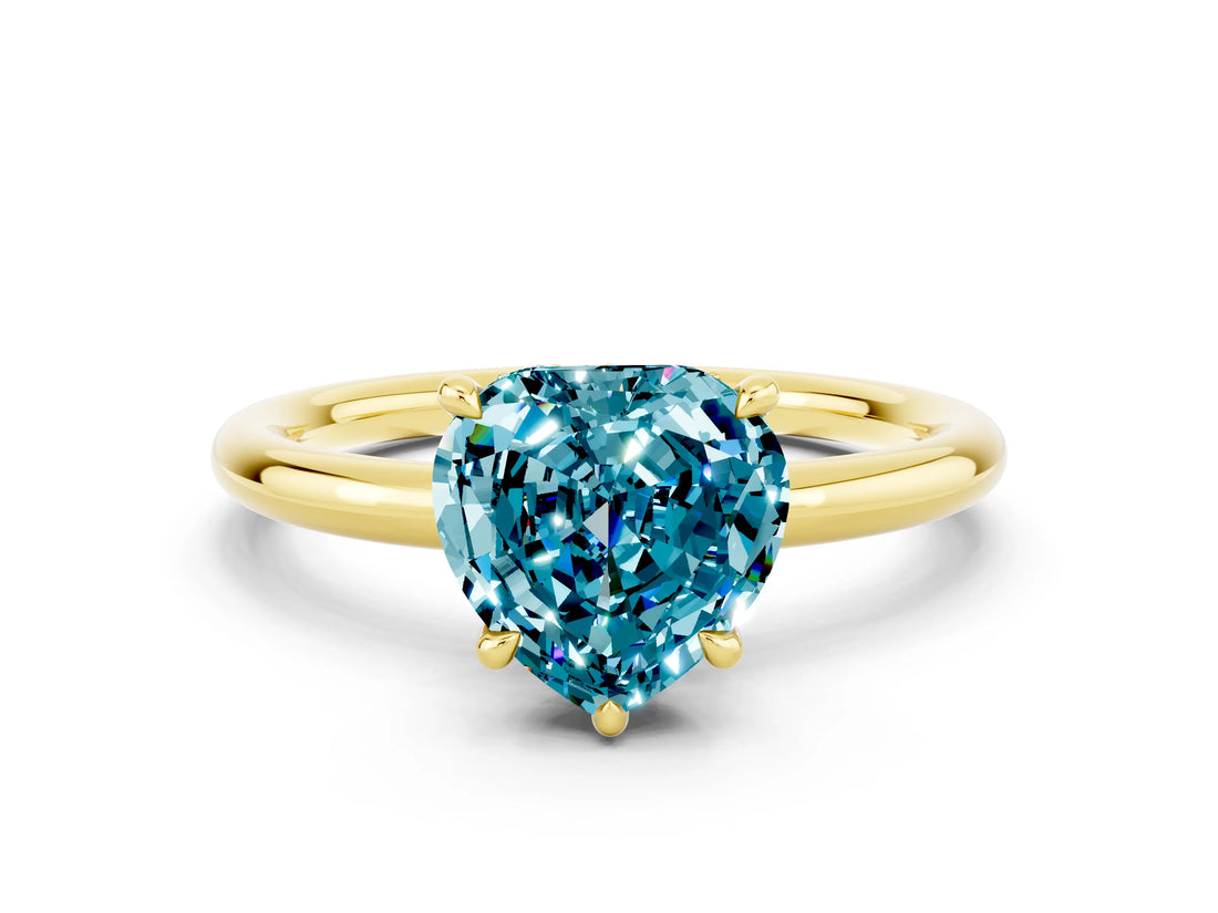 Yellow gold Heart Cut Blue Topaz Solitaire Ring with Thin Band and Four-Prong Setting