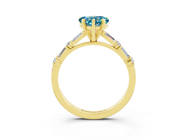 Yellow gold Heart Cut Blue Topaz Solitaire with Side Baguettes and Channel Set Band