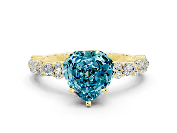 Yellow gold Heart Cut Blue Topaz Side Stone Solitaire Ring with Round  and Four-Prong Setting