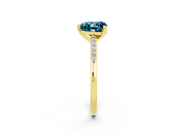 Yellow gold Heart Cut Blue Topaz Solitaire Ring with Channel Set Round  Band and Prong Setting