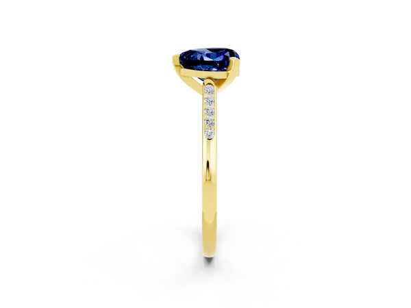 Yellow gold Heart Cut Blue Sapphire Solitaire Ring with Channel Set Round  Band and Prong Setting