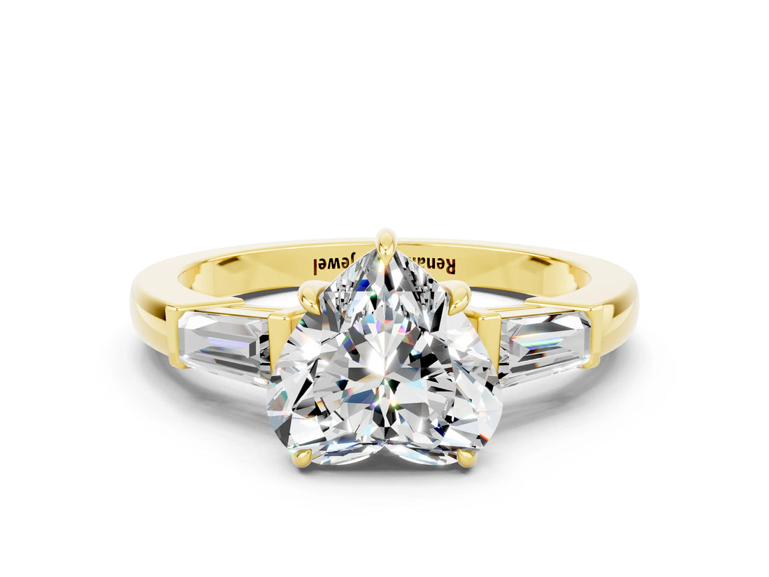 Yellow gold Heart Cut Cut Diamond Ring with Tapered Baguette Side Stones in Four-Prong Setting