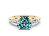 Yellow gold Heart Cut Cut Diamond Ring with Tapered Baguette Side Stones in Four-Prong Setting