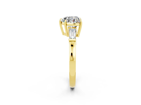 Yellow gold Heart Cut Moissanite Three-Stone Ring with Tapered Baguette Side Stones and Prong Setting