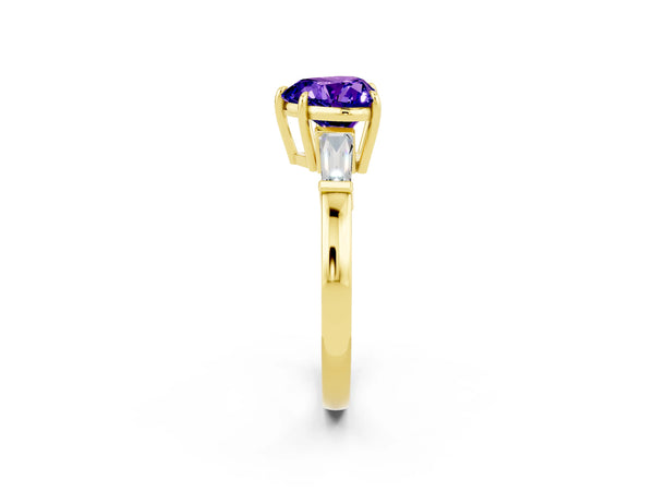Yellow gold Heart Cut Tanzanite Three-Stone Ring with Tapered Baguette Side Stones and Prong Setting