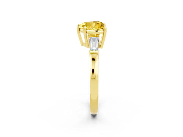 Yellow gold Heart Cut Yellow Sapphire Three-Stone Ring with Tapered Baguette Side Stones and Prong Setting