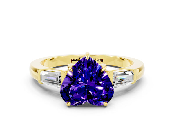 Yellow gold Heart Cut Tanzanite Three-Stone Ring with Tapered Baguette Side Stones and Prong Setting