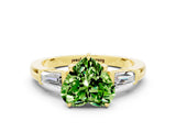 Yellow gold Heart Cut Cut Diamond Ring with Tapered Baguette Side Stones in Four-Prong Setting