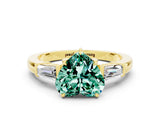 Yellow gold Heart Cut Cut Diamond Ring with Tapered Baguette Side Stones in Four-Prong Setting
