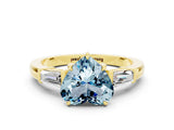Yellow gold Heart Cut Cut Diamond Ring with Tapered Baguette Side Stones in Four-Prong Setting