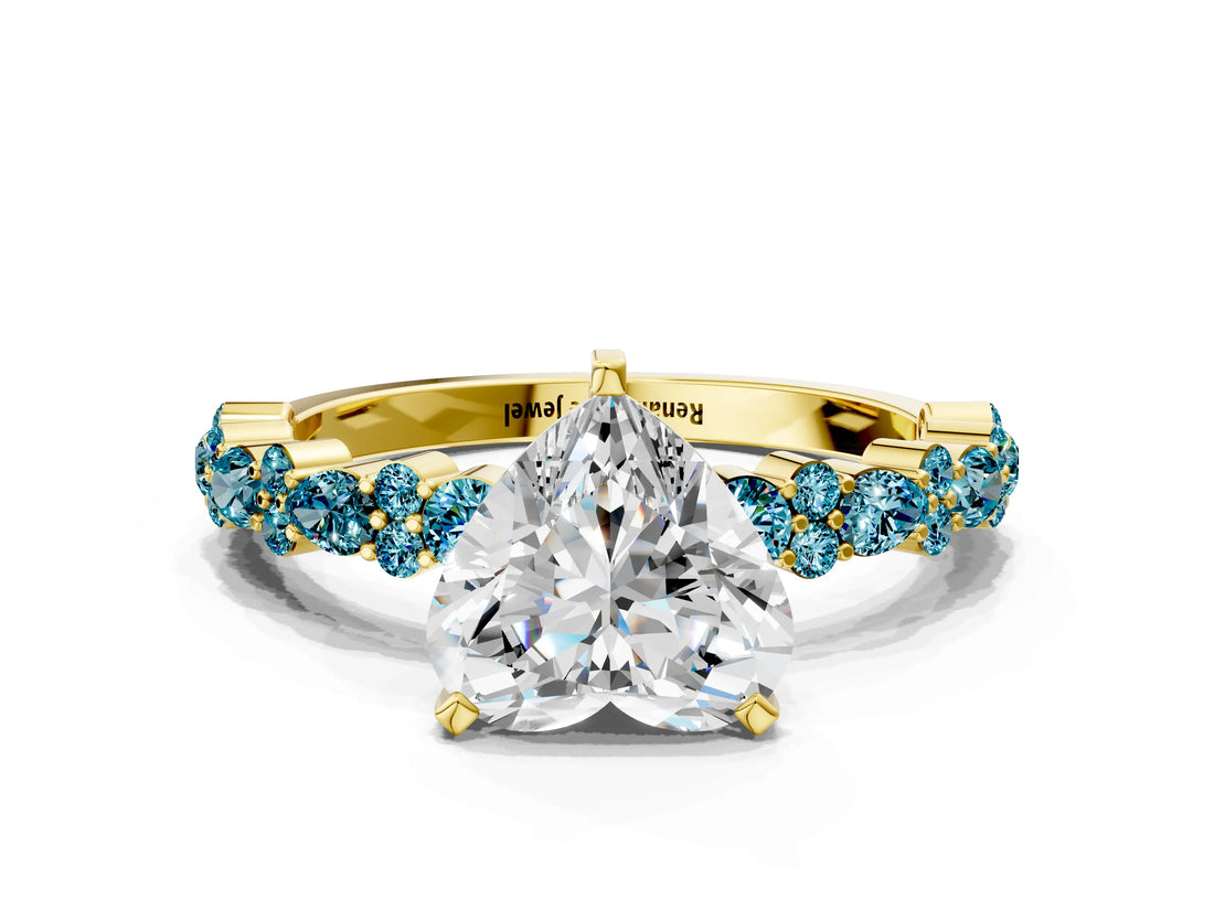 Yellow gold Heart Cut Diamond Side Stone Solitaire Ring with Round with Blue Topaz side stone and Four-Prong Setting