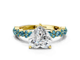 Yellow gold Heart Cut Diamond Side Stone Solitaire Ring with Round with Blue Topaz side stone and Four-Prong Setting