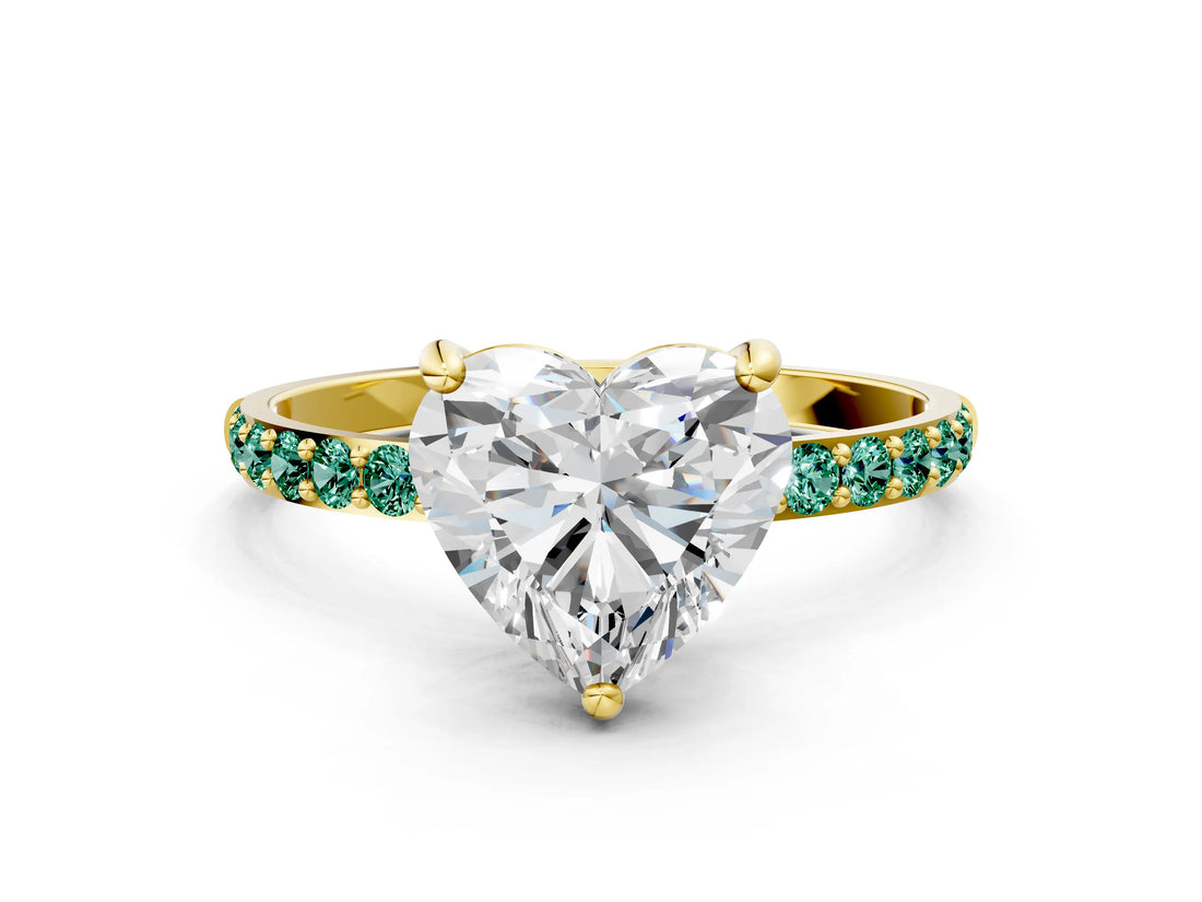 Yellow gold Heart Cut Diamond Solitaire Ring with Round with Green Sapphire side stone Pavé Band and Prong Setting