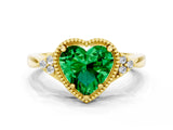 Yellow gold Heart Cut Emerald Halo Ring with Tapered Band and Four-Prong Setting