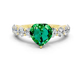 Yellow gold Heart Cut Emerald Prong Setting with Side Stones on a Pave Band
