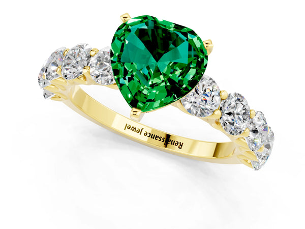 Yellow gold Heart Cut Emerald Prong Setting with Side Stones on a Pave Band