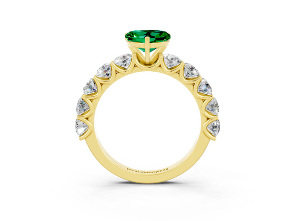 Yellow gold Heart Cut Emerald Prong Setting with Side Stones on a Pave Band