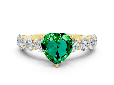 Yellow gold Heart Cut Emerald Prong Setting with Side Stones on a Pave Band