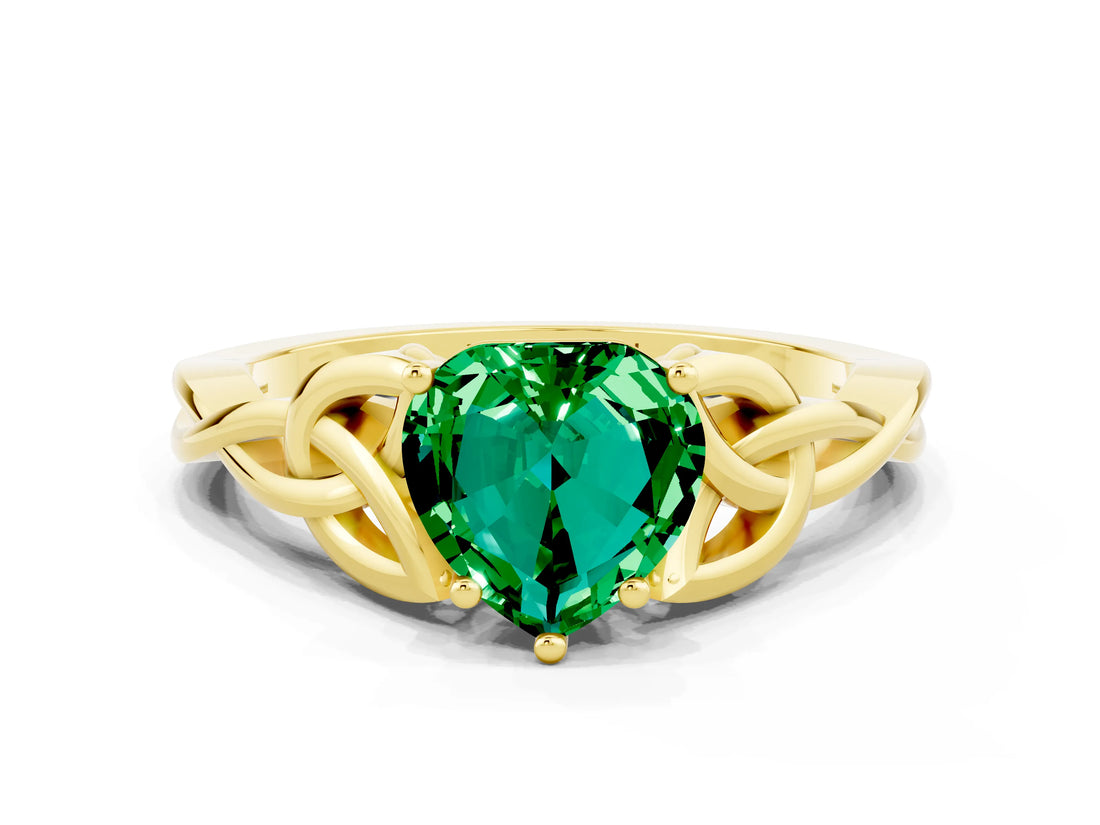 Yellow gold Heart Cut Emerald Solitaire Engagement Ring with Celtic Knot Band and Four-Prong Setting