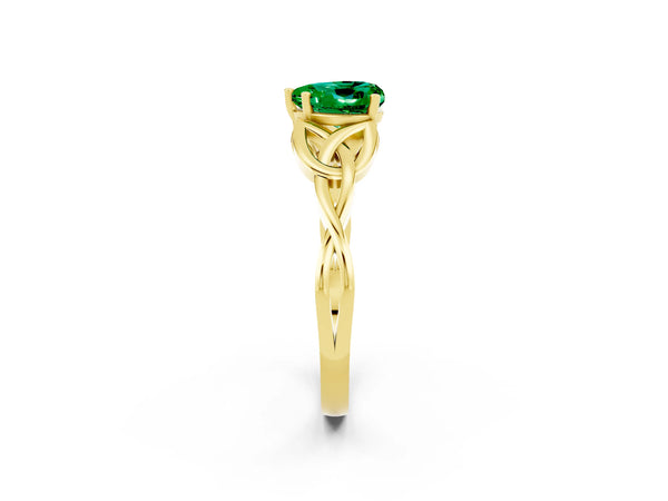 Yellow gold Heart Cut Emerald Solitaire Engagement Ring with Celtic Knot Band and Four-Prong Setting