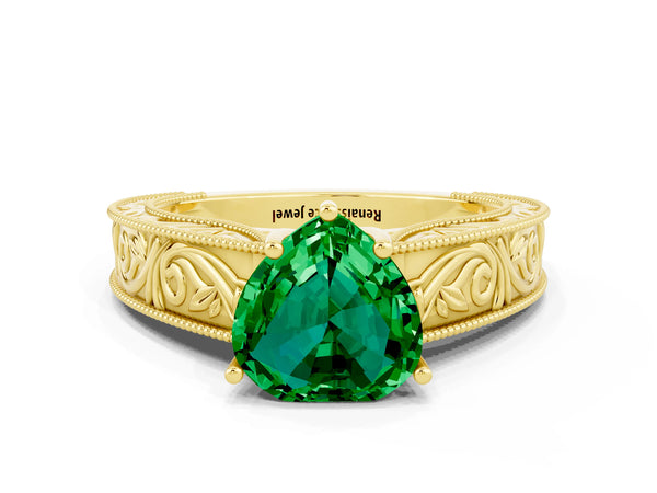 Yellow gold Heart Cut Emerald Solitaire Ring with Engraved Band and Four-Prong Setting