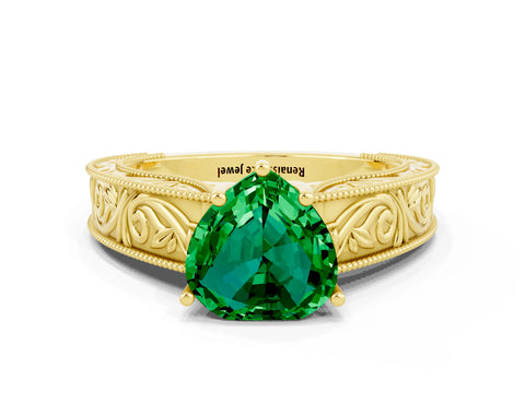 Yellow gold Heart Cut Emerald Solitaire Ring with Engraved Band and Four-Prong Setting