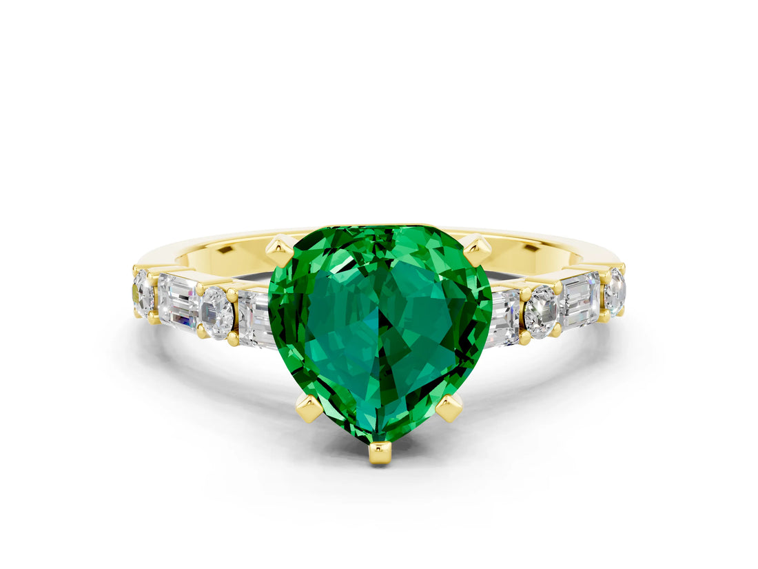 Yellow gold Heart Cut Emerald Solitaire with Side Baguettes and Channel Set Band
