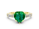 Yellow gold Heart Cut Emerald Solitaire with Side Baguettes and Channel Set Band