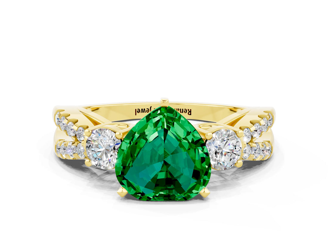 Yellow gold Heart Cut Emerald Three-Stone Ring with Pavé Split Shank and Four-Prong Setting