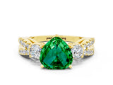 Yellow gold Heart Cut Emerald Three-Stone Ring with Pavé Split Shank and Four-Prong Setting