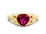 Yellow gold Heart Cut Garnet Solitaire Engagement Ring with Celtic Knot Band and Four-Prong Setting