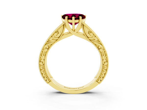 Yellow gold Heart Cut Garnet Solitaire Ring with Engraved Band and Four-Prong Setting