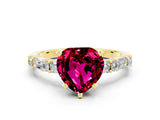 Yellow gold Heart Cut Garnet Solitaire with Side Baguettes and Channel Set Band
