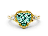 Yellow gold Heart Cut Green Sapphire Halo Ring with Tapered Band and Four-Prong Setting