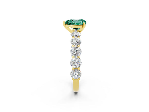 Yellow gold Heart Cut Green Sapphire Prong Setting with Side Stones on a Pave Band