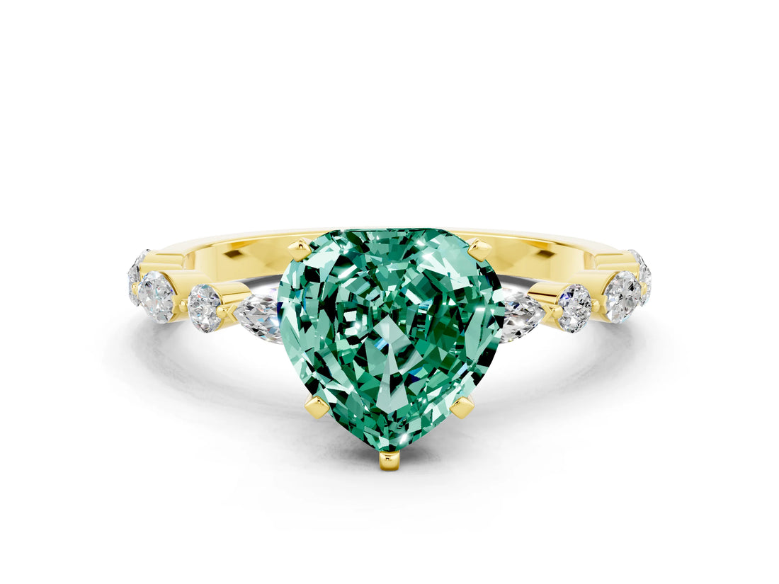 Yellow gold Heart Cut Green Sapphire Solitaire with Side Stones on a Pavé Band and Four-Prong Setting