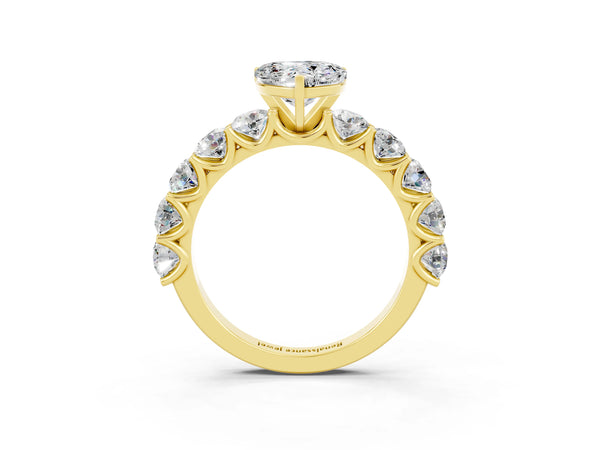 Yellow gold Heart Cut Moissanite Prong Setting with Side Stones on a Pave Band