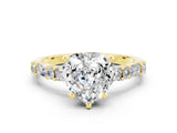 Yellow gold Heart Cut Moissanite Solitaire with Side Baguettes and Channel Set Band