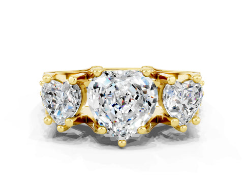 Yellow gold Heart Cut Moissanite Three-Stone Ring with Channel Set Band and Four-Prong Setting