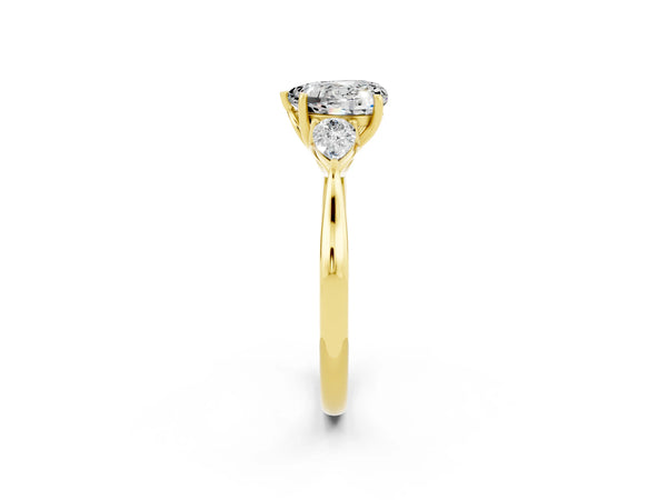 Yellow gold Heart Cut Moissanite Three-Stone Ring with Pear  Side Stones and Prong Setting