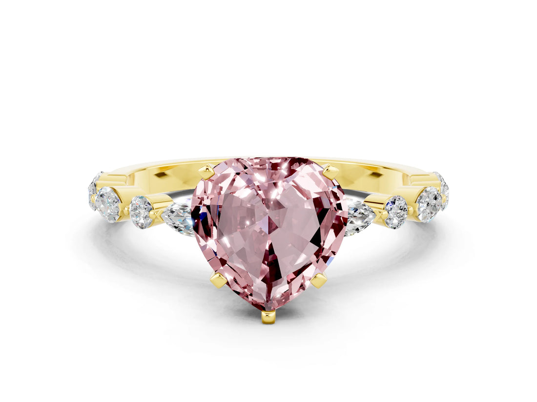 Yellow gold Heart Cut Morganite Solitaire with Side Stones on a Pavé Band and Four-Prong Setting