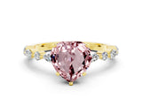 Yellow gold Heart Cut Morganite Solitaire with Side Stones on a Pavé Band and Four-Prong Setting