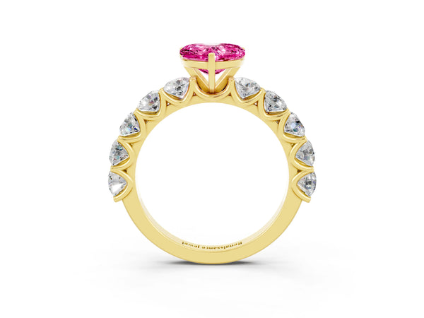 Yellow gold Heart Cut Pink Sapphire Prong Setting with Side Stones on a Pave Band