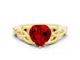 Yellow gold Heart Cut Ruby Solitaire Engagement Ring with Celtic Knot Band and Four-Prong Setting