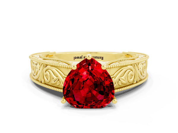 Yellow gold Heart Cut Ruby Solitaire Ring with Engraved Band and Four-Prong Setting