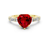 Yellow gold Heart Cut Ruby Solitaire with Side Baguettes and Channel Set Band