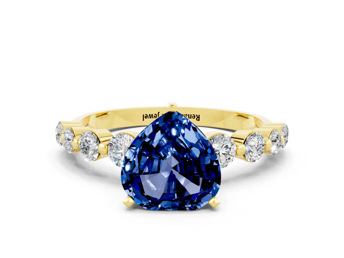 Yellow gold Heart Cut Solitaire Blue Sapphire Ring with Pave Band and Four-Prong Setting