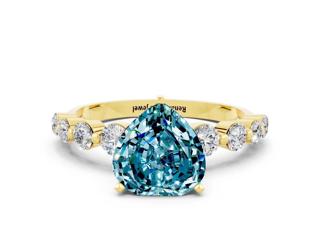 Yellow gold Heart Cut Solitaire Blue Topaz Ring with Pave Band and Four-Prong Setting