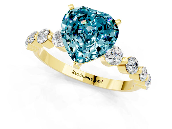 Yellow gold Heart Cut Solitaire Blue Topaz Ring with Pave Band and Four-Prong Setting