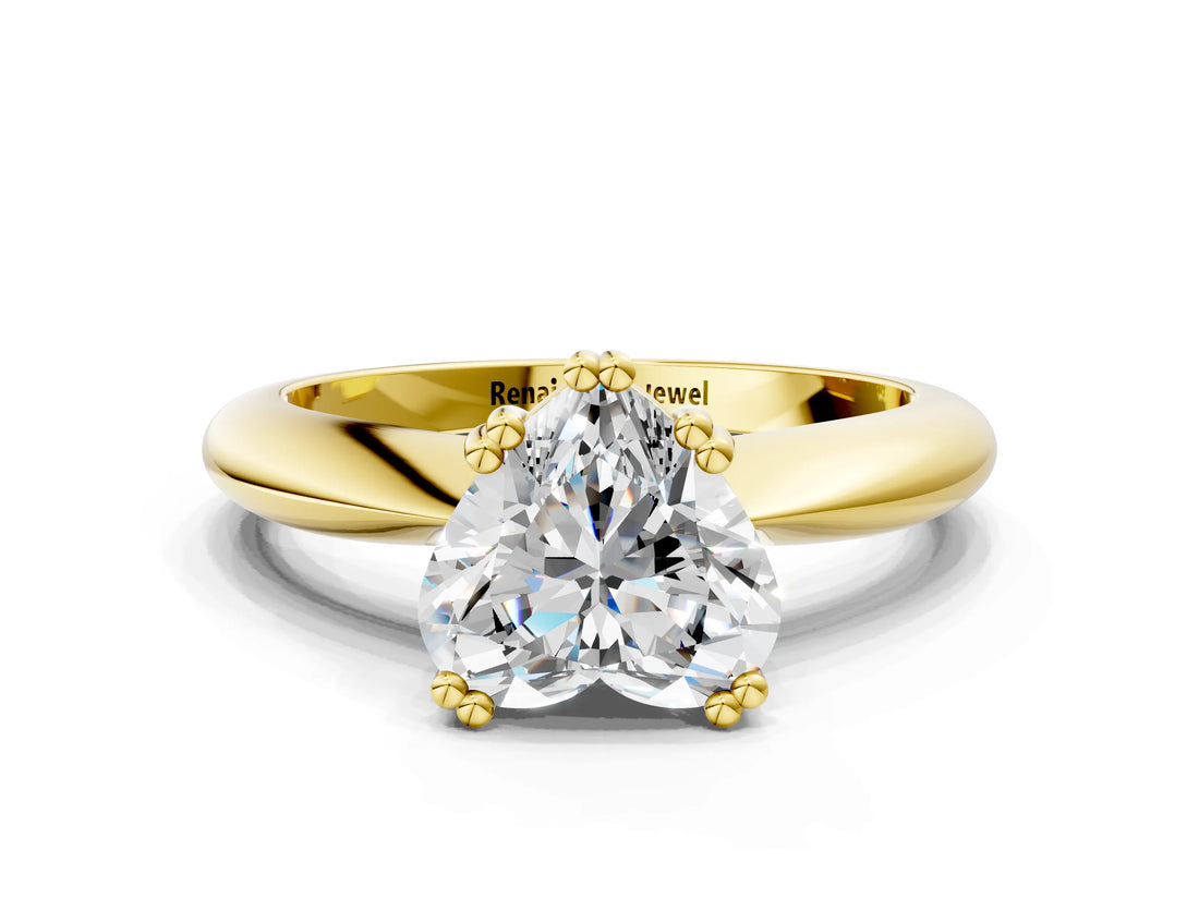 Yellow gold Heart Cut Solitaire Engagement Ring with Tapered Band and Four-Prong Setting